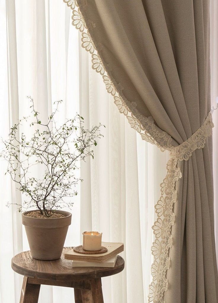 soft beige curtains with lace detail creating cozy renter friendly space