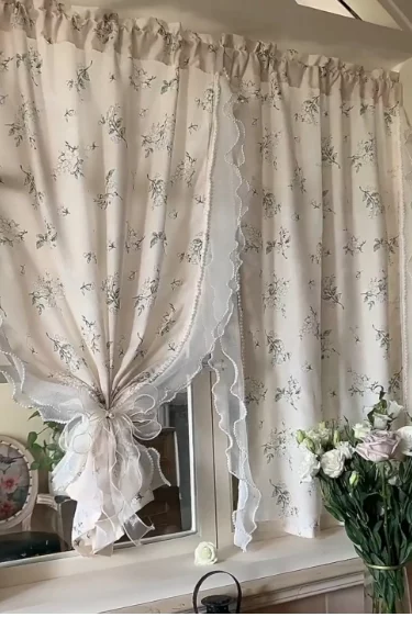 soft beige curtains with lace detail creating cozy renter friendly space
