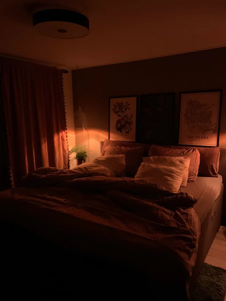 cozy living room with warm lighting curtains and neutral decor