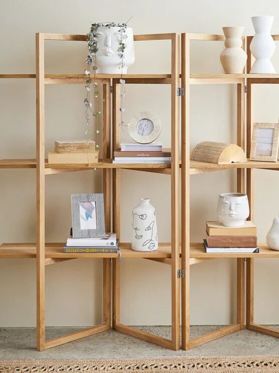 minimal wooden shelves styling with books and decor for small apartment