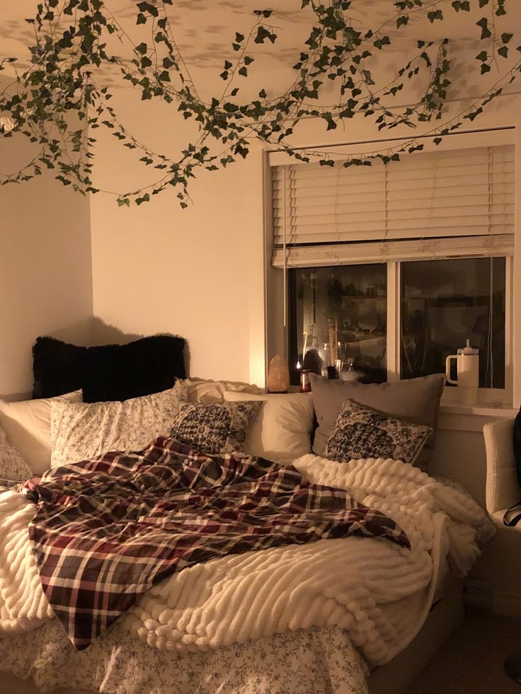 cozy bed with layered blankets and soft neutral tones renter bedroom decor