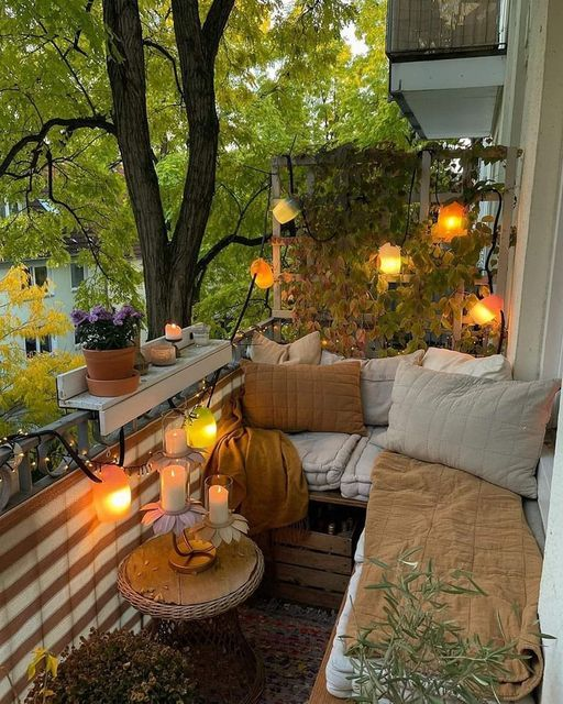 Cozy balcony reading nook with string lights and soft seating